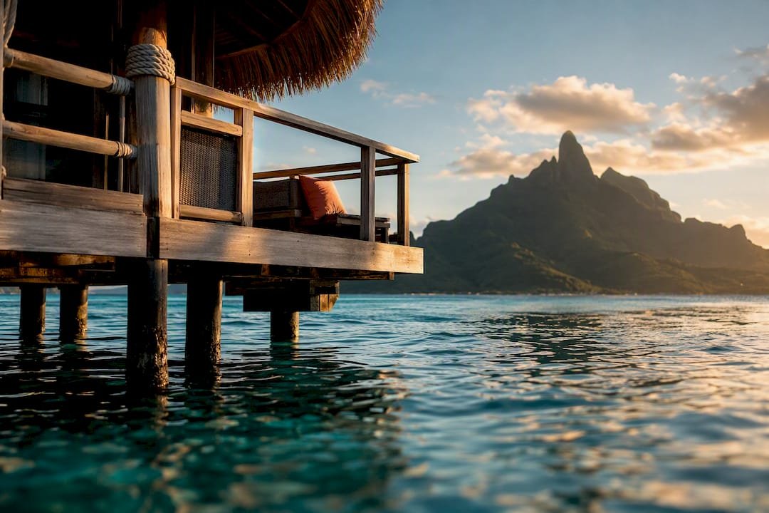 Tahiti overwater bungalow above turquoise lagoon